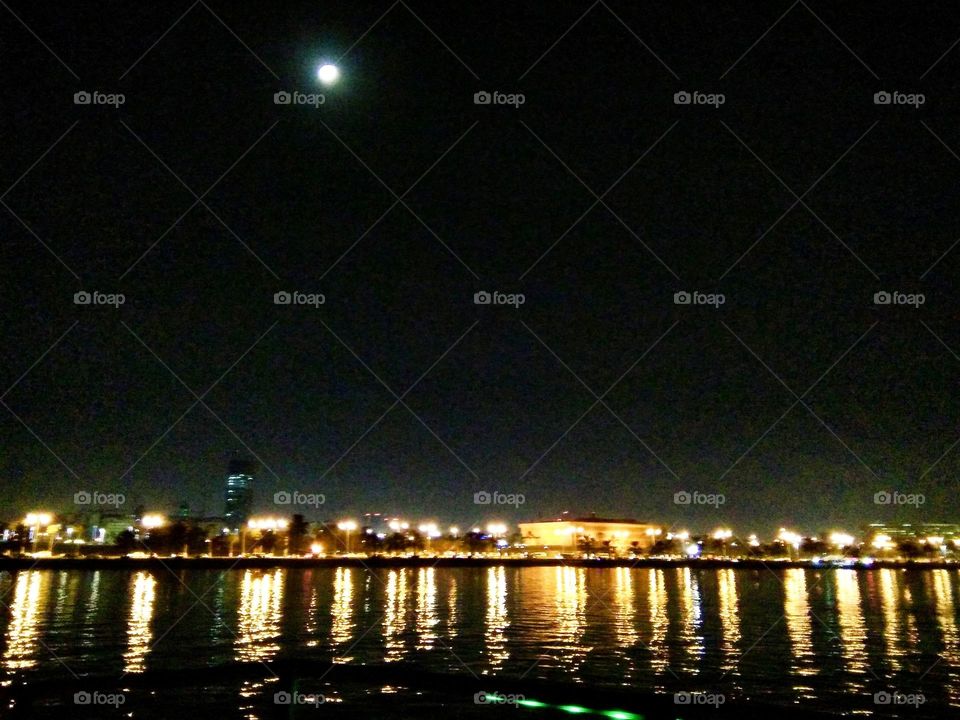 Lovely moon shining brightly while dhow cruise journey at Corniche Doha.