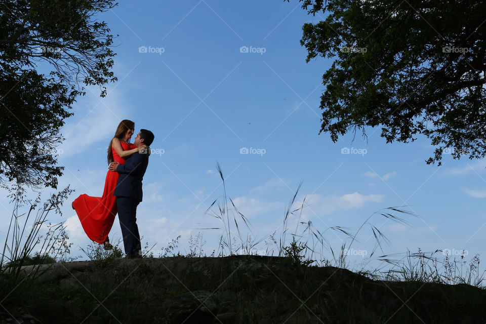 Couple kissing and hugging . Young couple hug and kiss