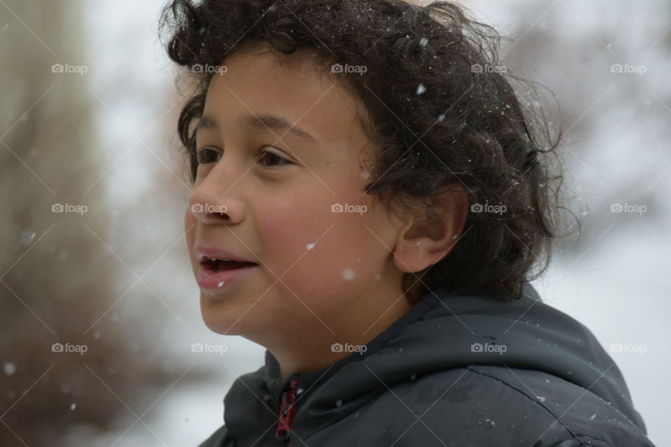 Close-up of a boy in blizzard
