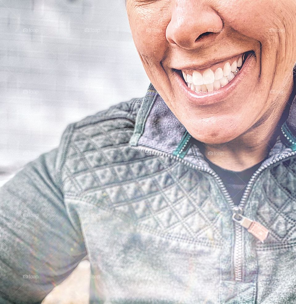 Woman smiling in quilted pullover, woman smiling, selfie outdoors, woman in the fall time