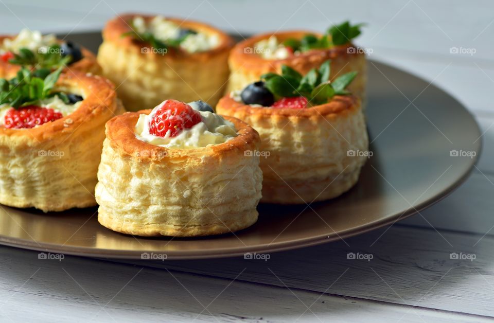 Vol-au-vent with berries and whipped cream