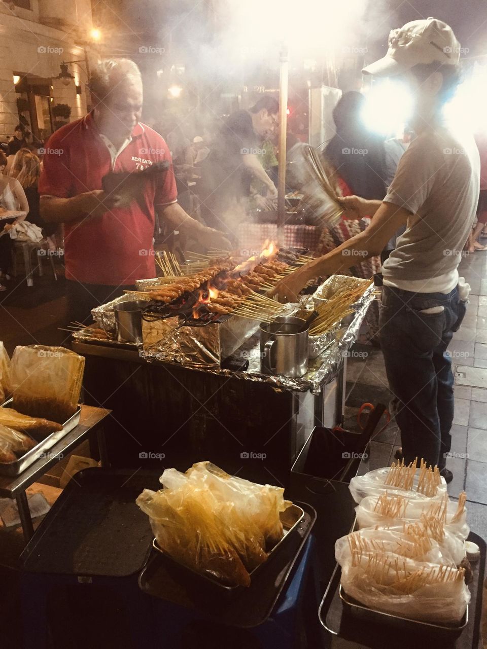 Street food market in Singapore, skewers street seller, fast food in Singapore, small business 