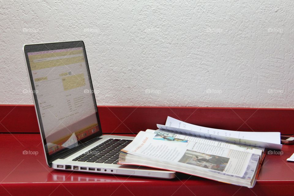 Macbook and a book on the table