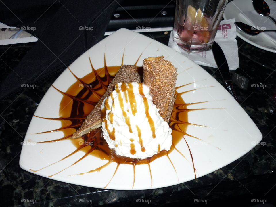 Deep fried Bananas with whipped cream and caramel sauce