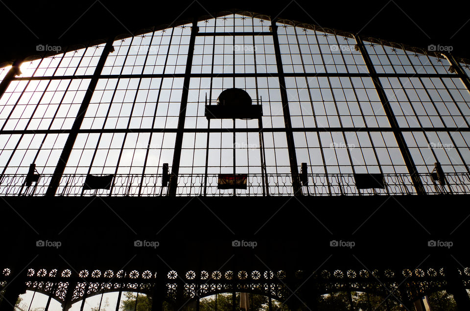 Low angle view of silhouette of train station entrance in Budapest, Hungary.