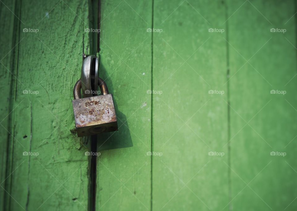Old lock. Old lock on the green wooden door