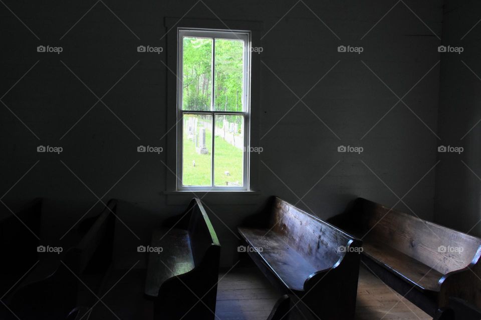 Wooden pews inside an old church 