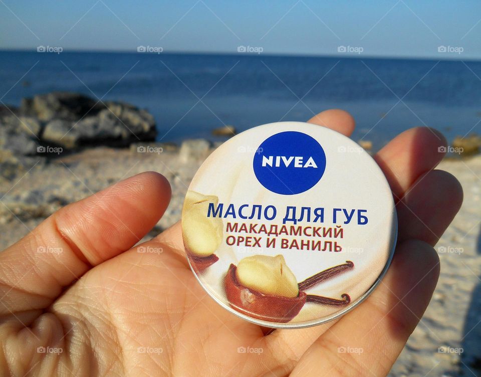 make up product Nivea in the hand summer vacation