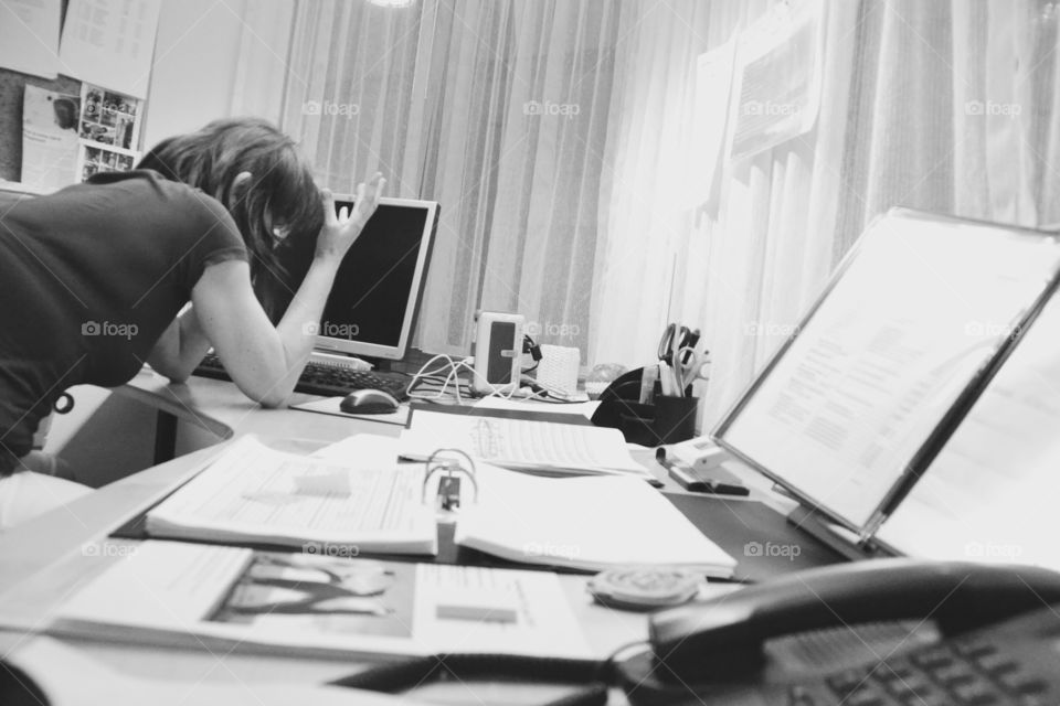 Frustrated Woman. Frustrated over endless paperwork 