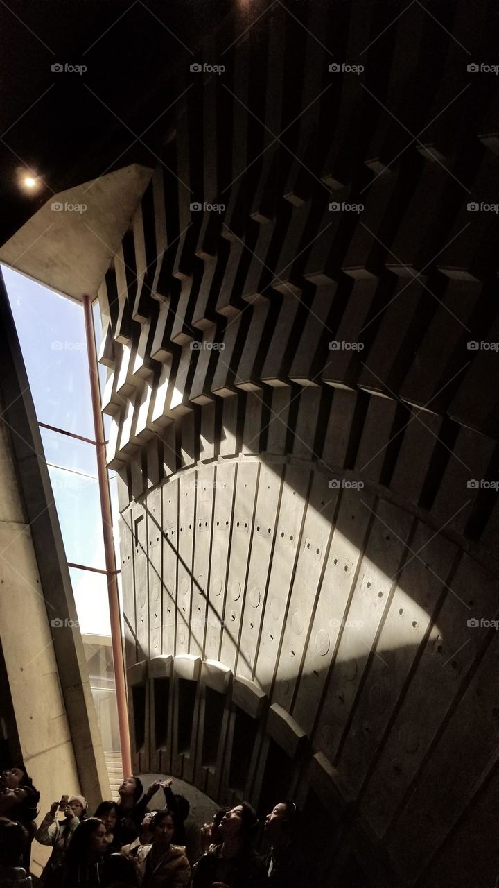 A group of people tour the Sydney Opera House