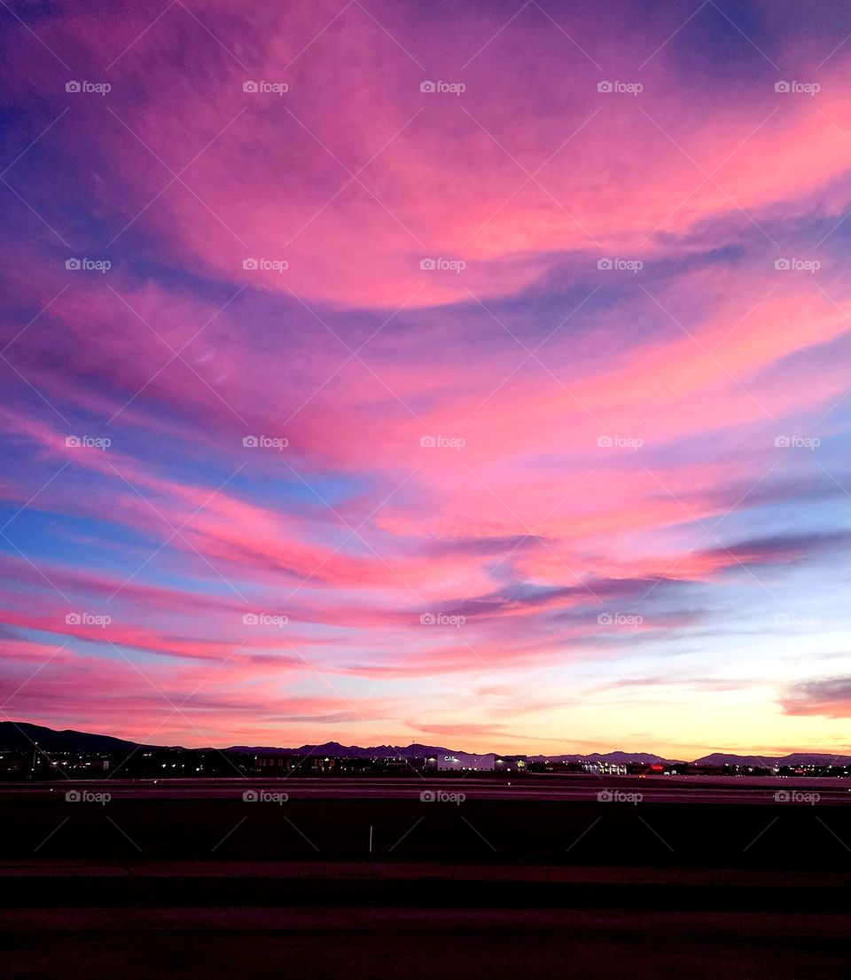 Bright pink clouds are the result of a brilliant sunset on a cool fall evening