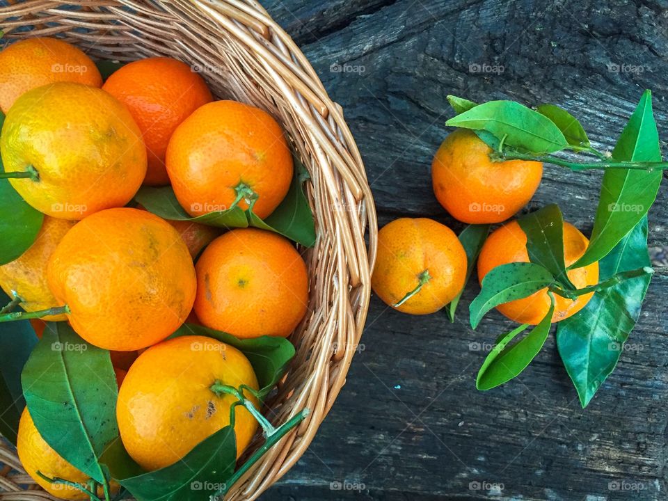 Basket filled with tangerine fruits