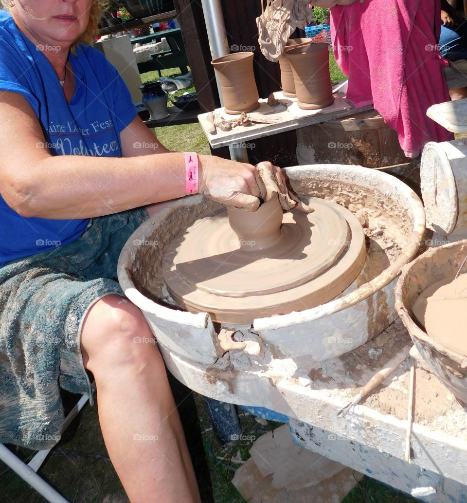 Woman spinning pottery