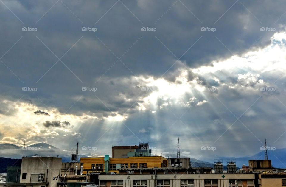 The crepuscular rays in the morning, it rayed all over the land, a sacred and peaceful feelings. the sky is beautiful in that dawn.