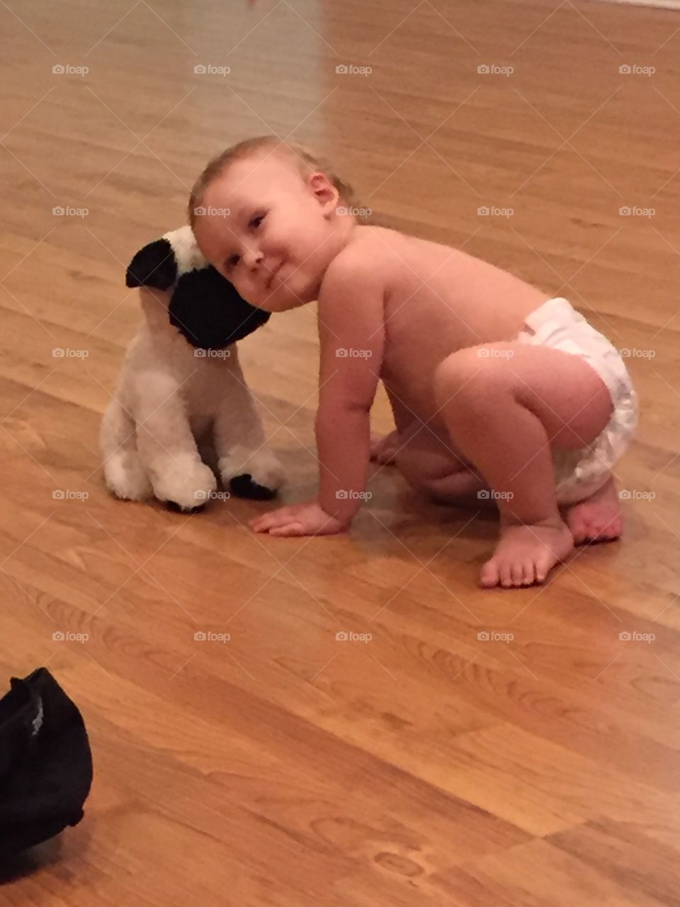 Playing inside with stuffed doggy