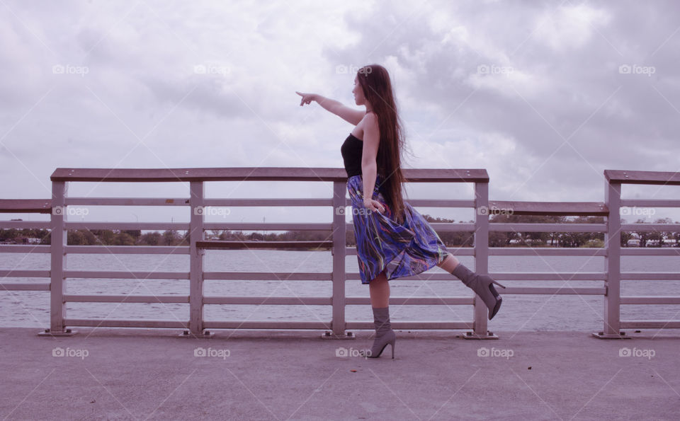 woman pointing on a gloomy day