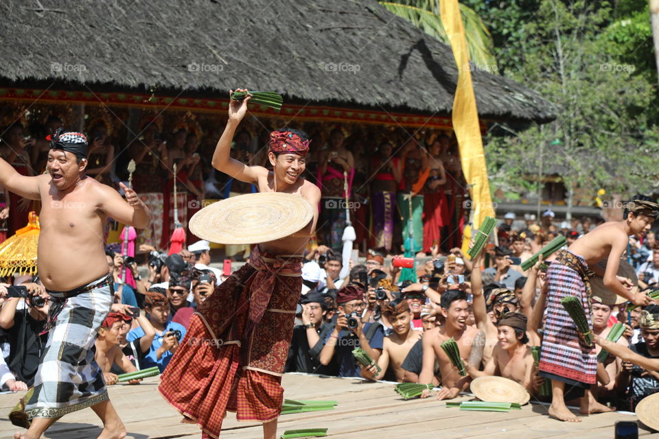 A local man prepares to fight an opponent with thorny pandan leaves in the village of Tenganan in Bali, Indonesia during the annual perang pandan festival.