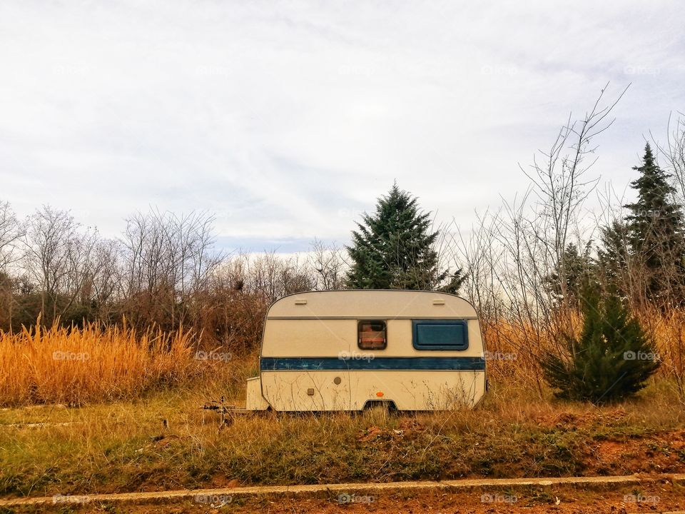 Caravan immersed in autumnal nature