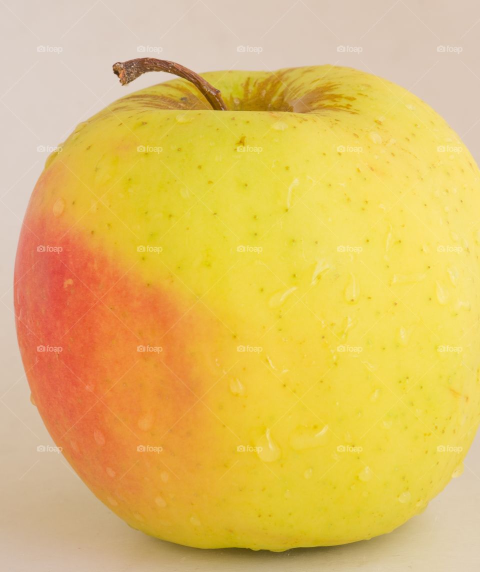 A yellow Apple.
