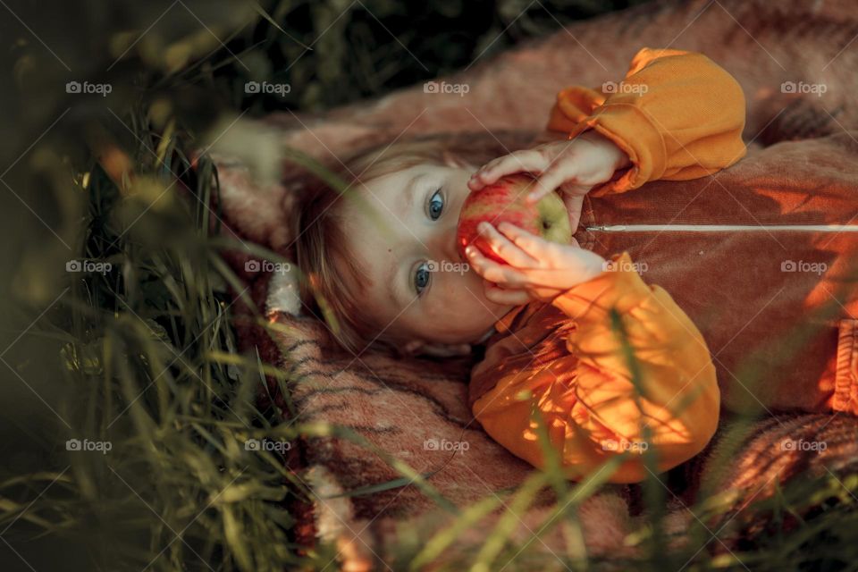 Little girl in apple tree 