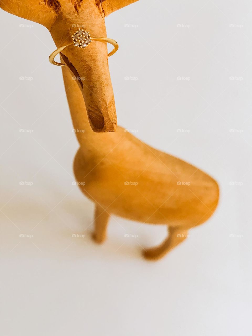 Diamond ring in a wooden giraffe object