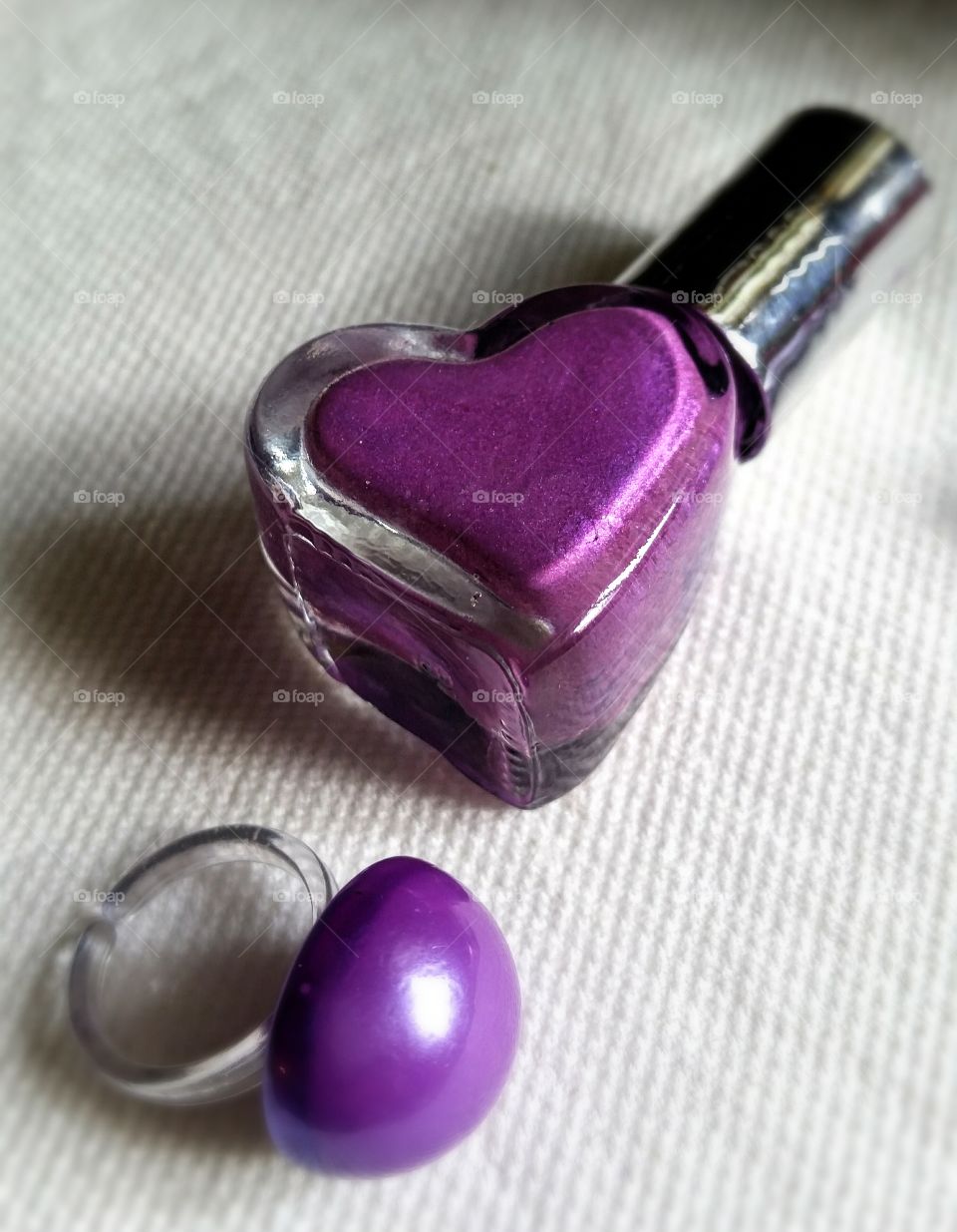 Heart shape nail polish bottle with purple ring