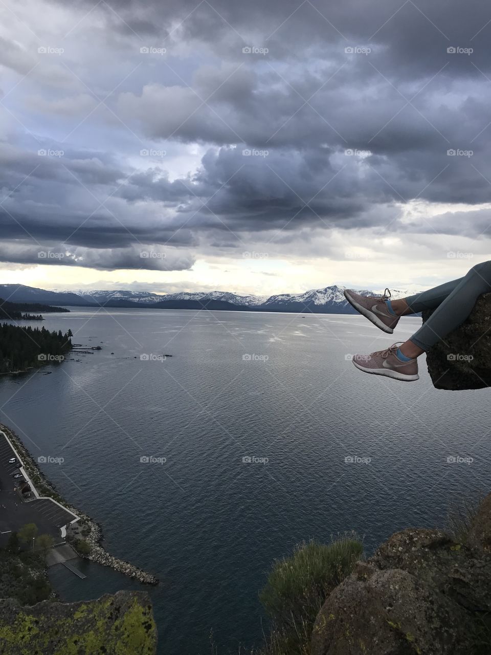 What an rewarding view after a steep climb. Hope not to fall off the rock that’s hanging. 