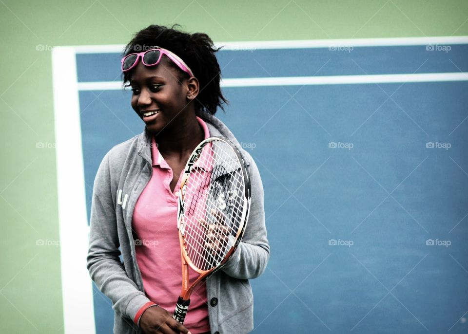 Local girl from community center playing tennis at the ATP at the Lindner family Tennis Center. 