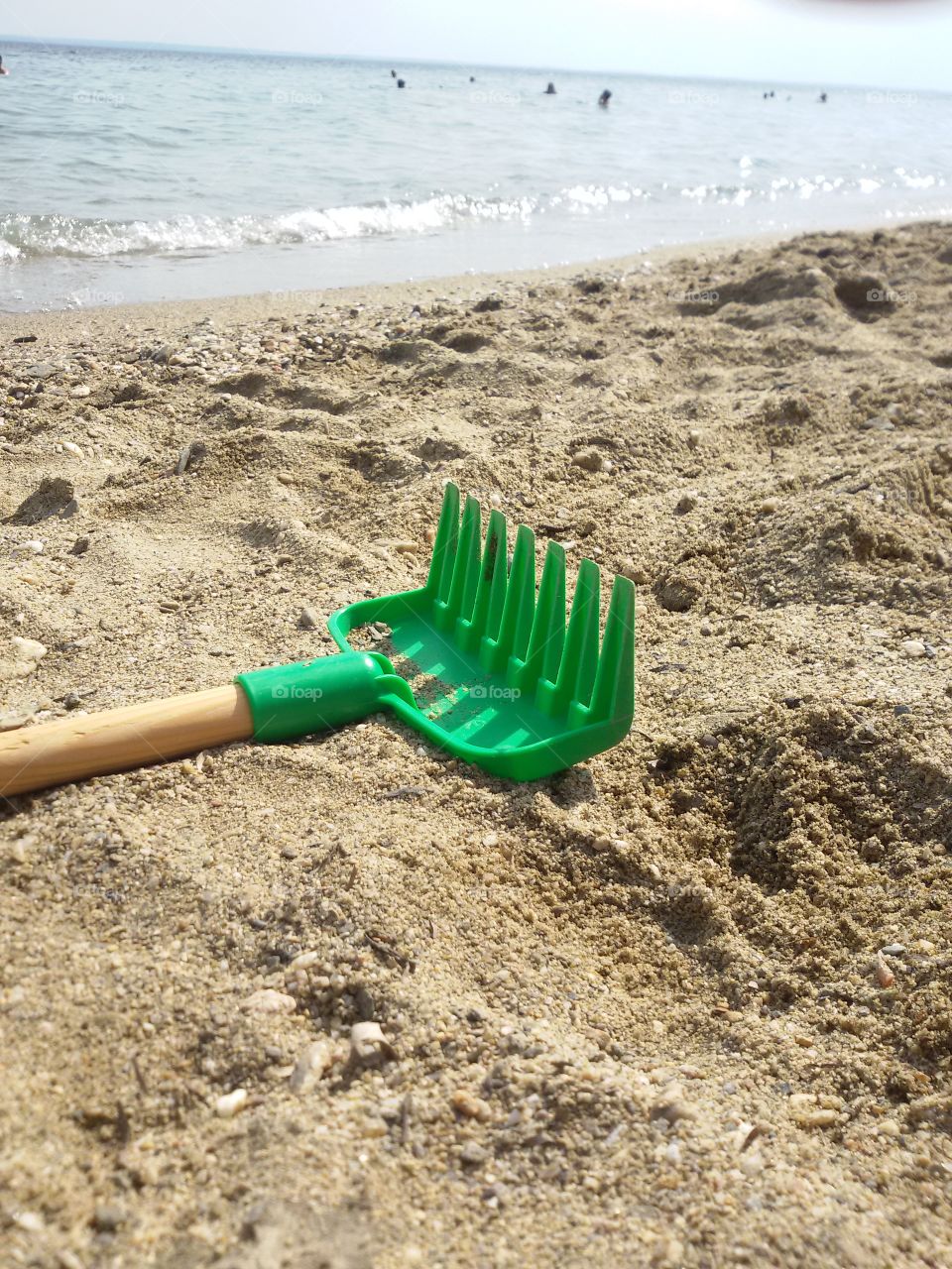 Plastic Kids rake on the beach