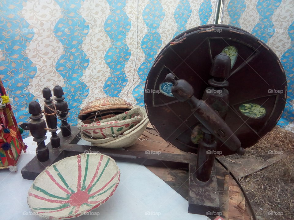 CHARKHA:- a domestic spinning wheel used chiefly for cotton.