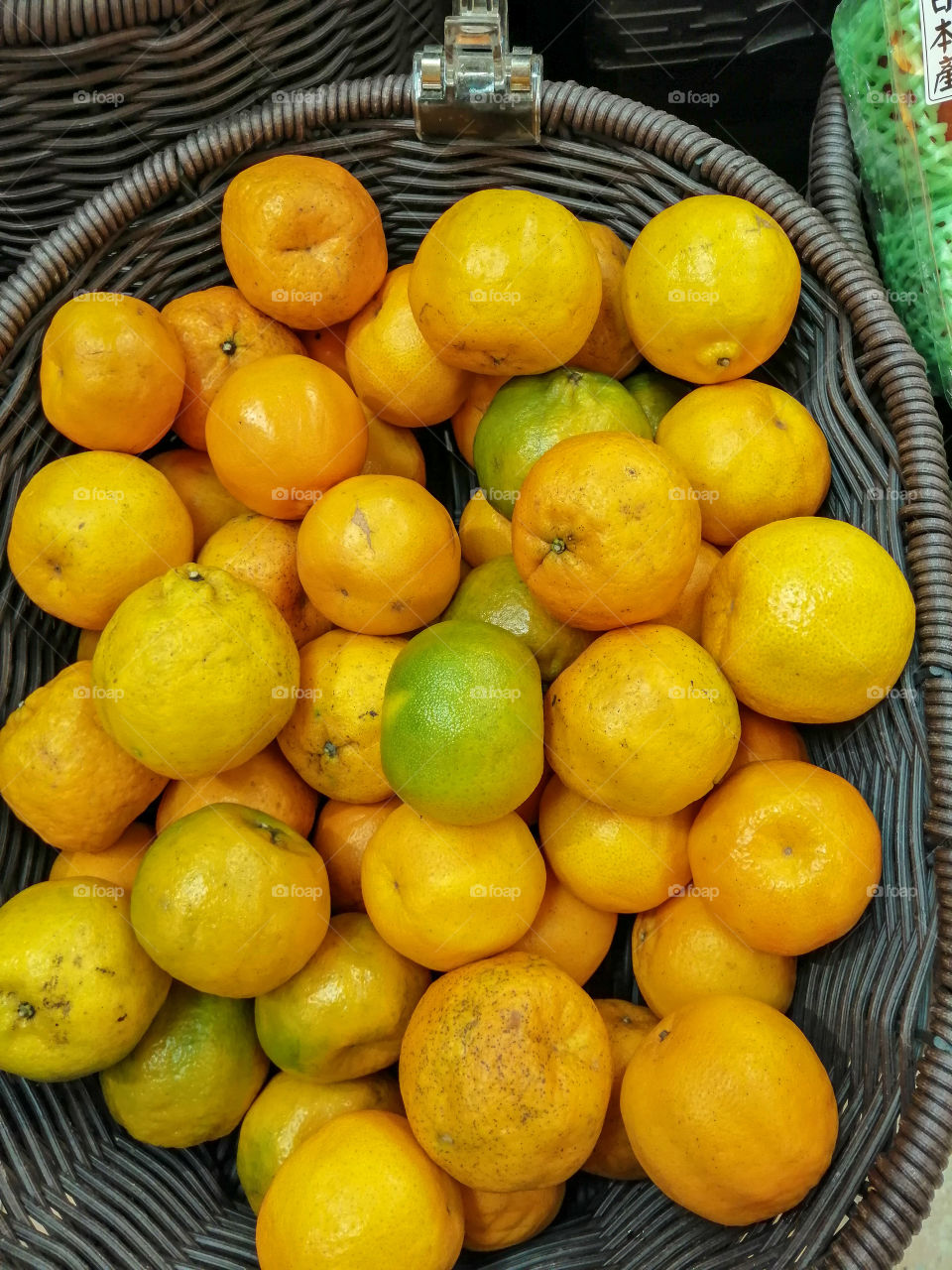 Mandarins in a basket for sale