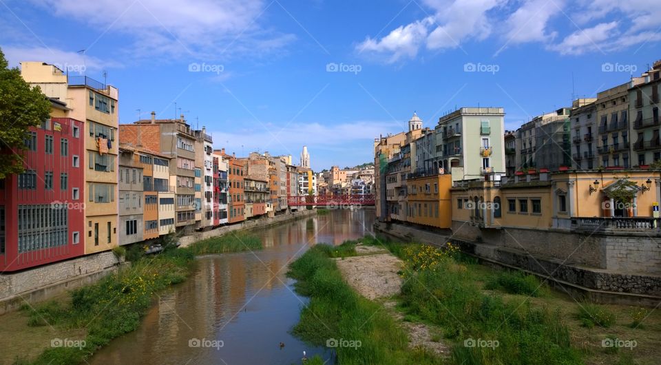 View of the city of Girona. Landscape of Girona from the bridge over the Onyar river