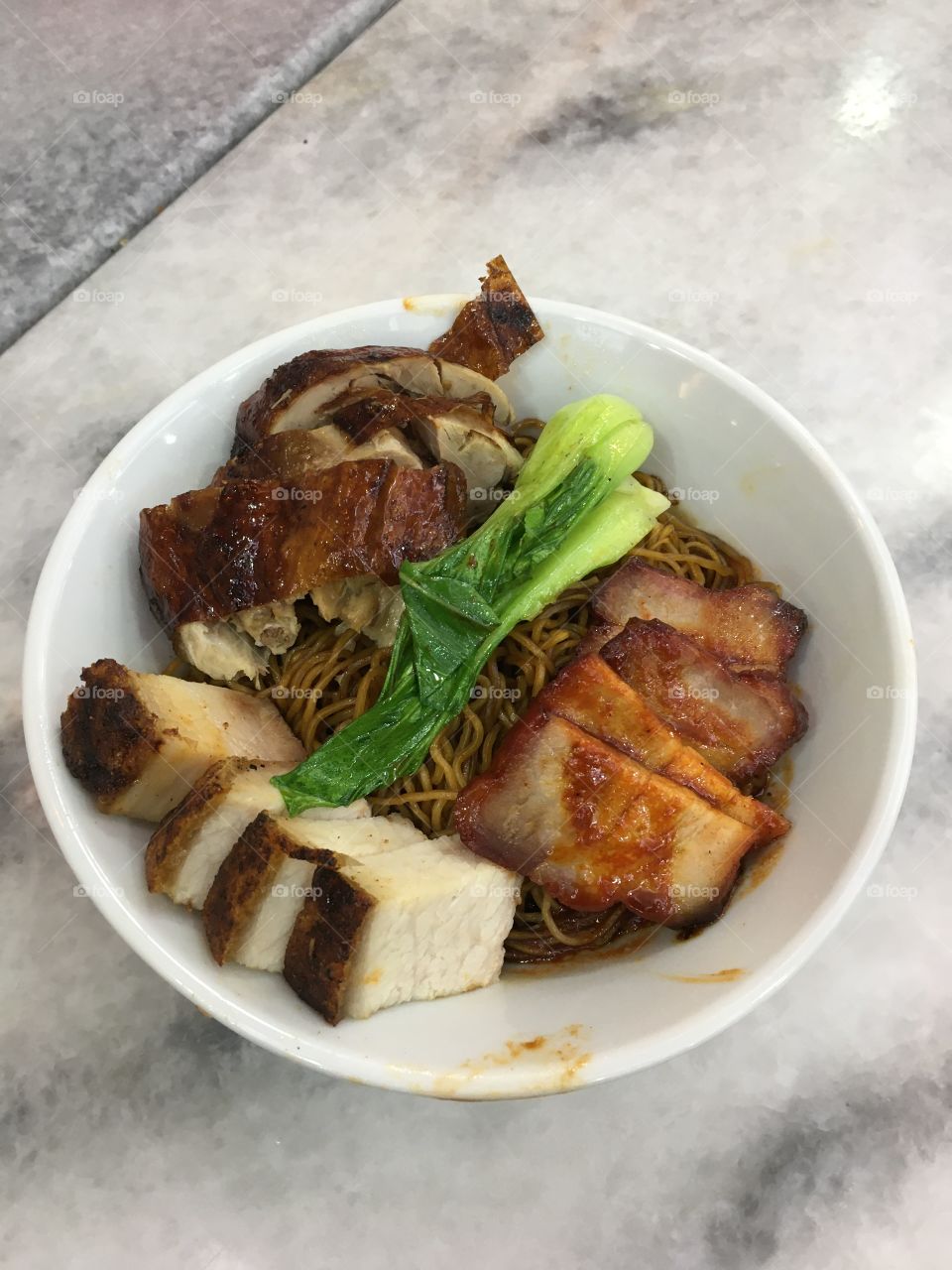 Noodles with roast pork, braised pork and roast duck