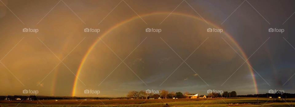 Rainbow encompassing a church. Pride Light shining bright!