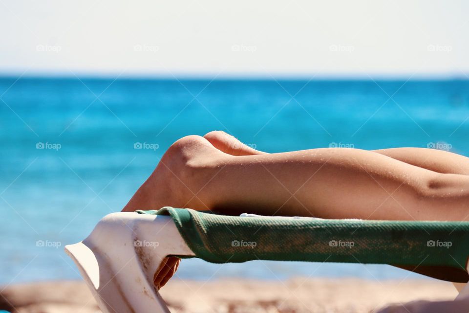  Catching suntan by the sea 