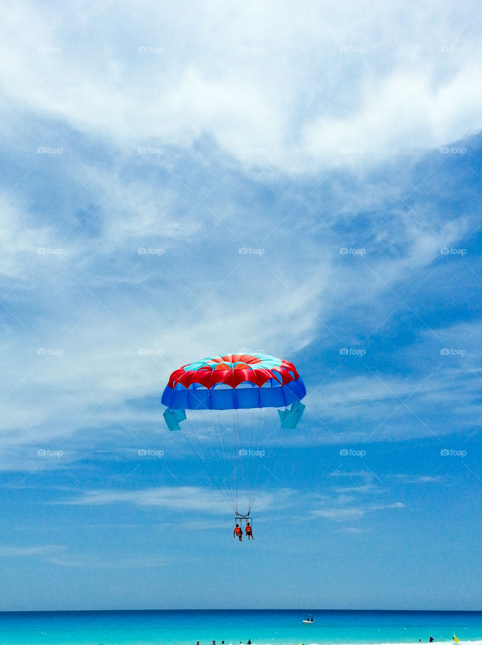 A people enjoying in parachute