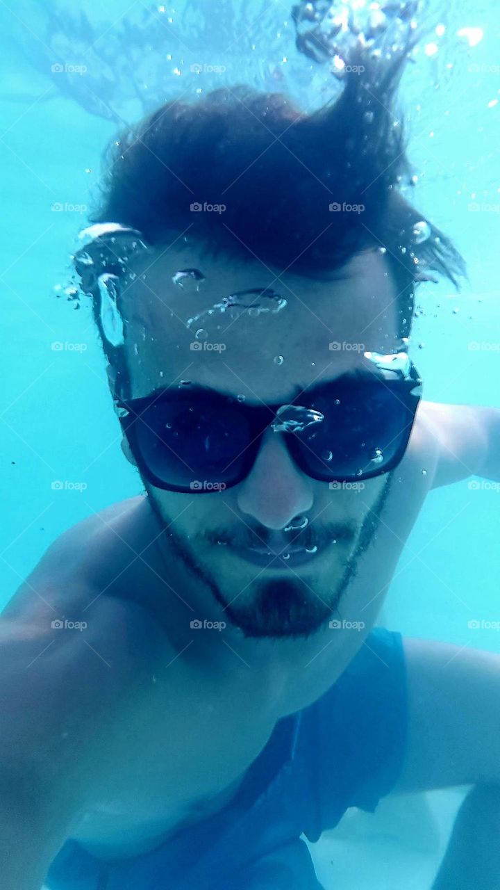 bearded boy under water