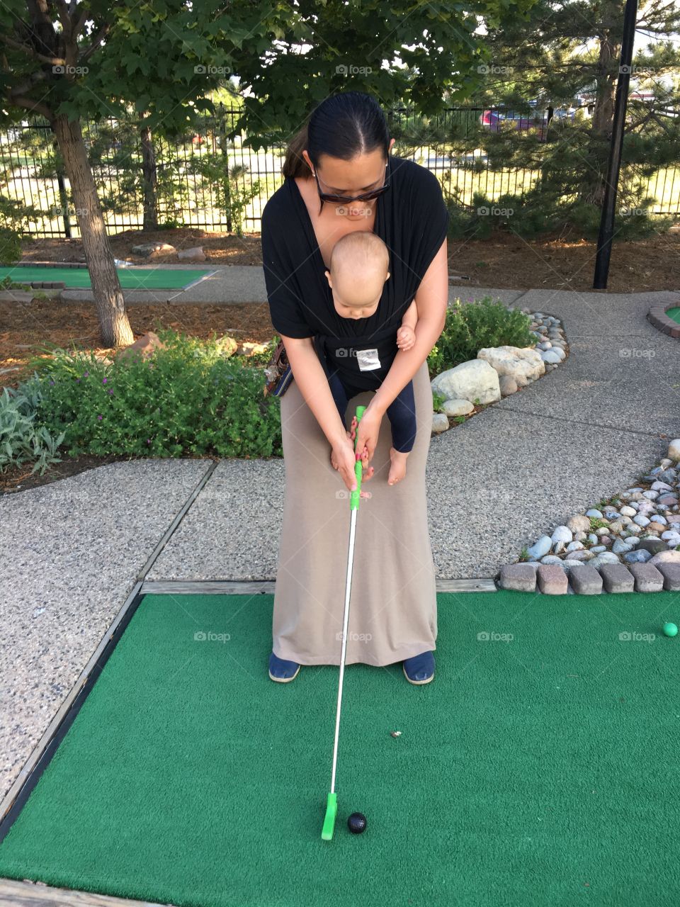 Miniature golfing with a baby