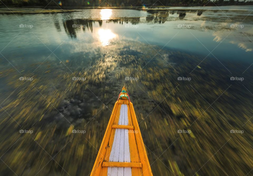 Kayaking on the lake at sunset