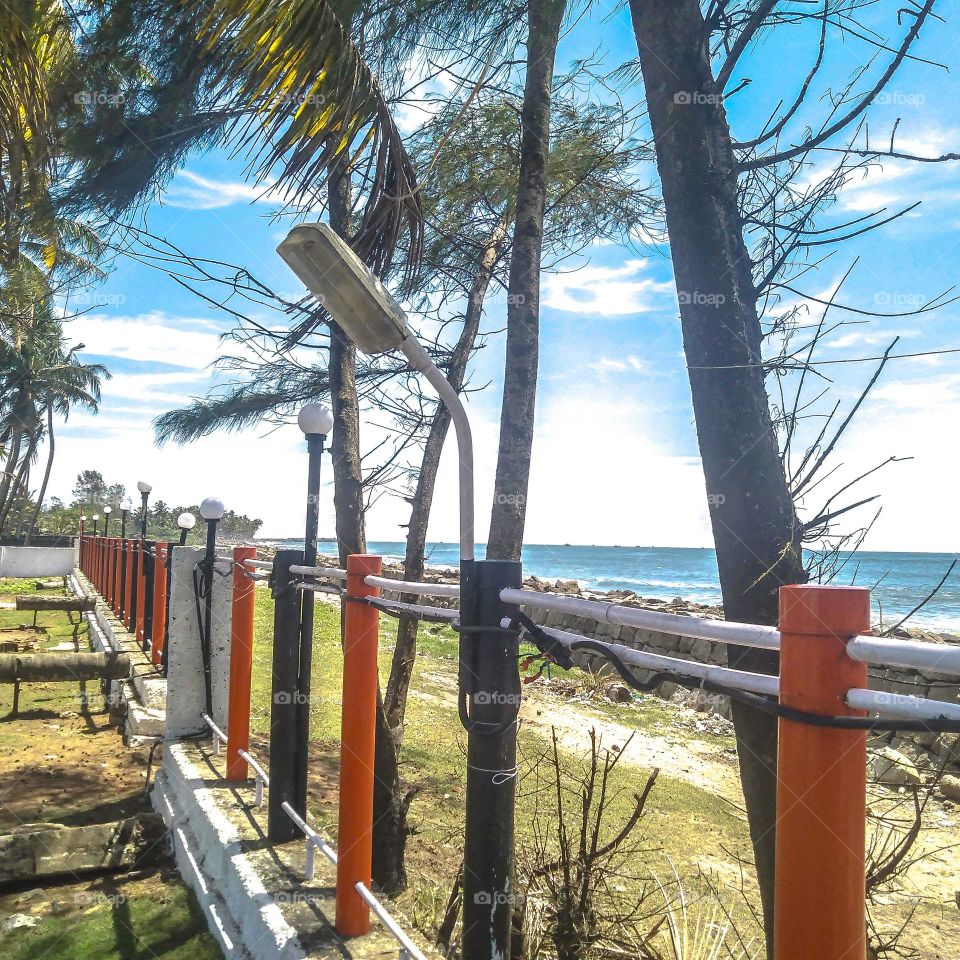 A fence and granite wall border the complex with beautiful coastal views