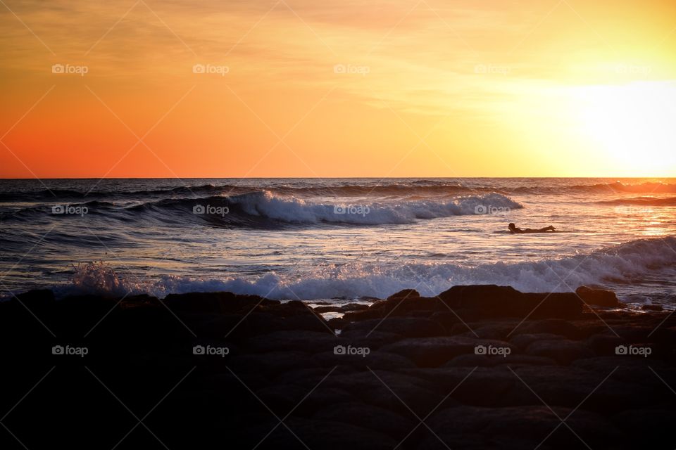 Paddling out at sunset, Kauai