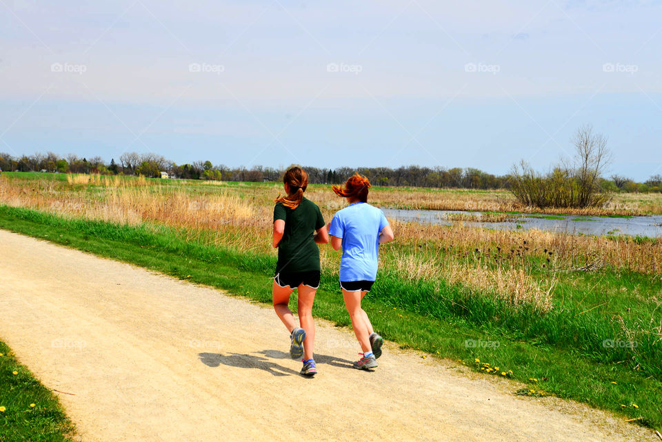 jogging. Two female joggers at Rollins Savanna Forest Preserve
