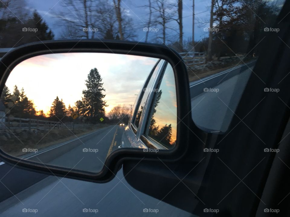 Rear view mirror sunset, reflections of beauty 