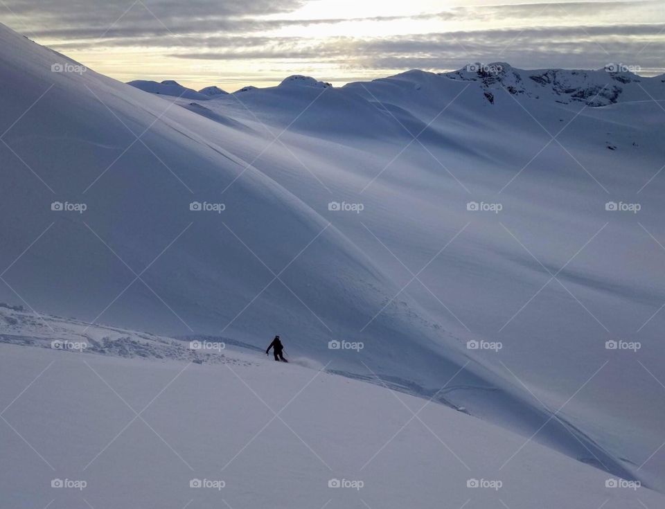 Social distancing , joy with slides on snow mountain. 
