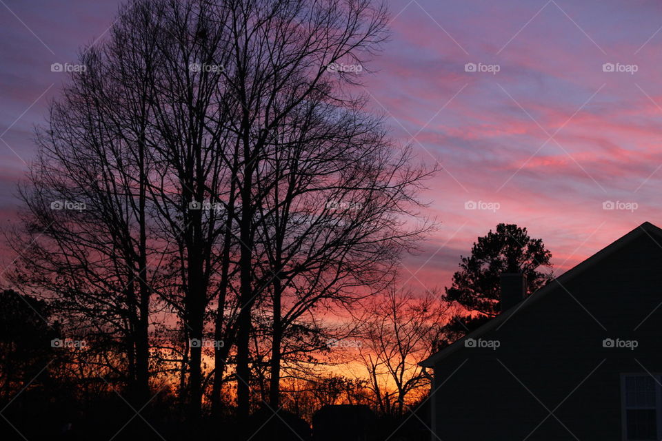 Sunset over house