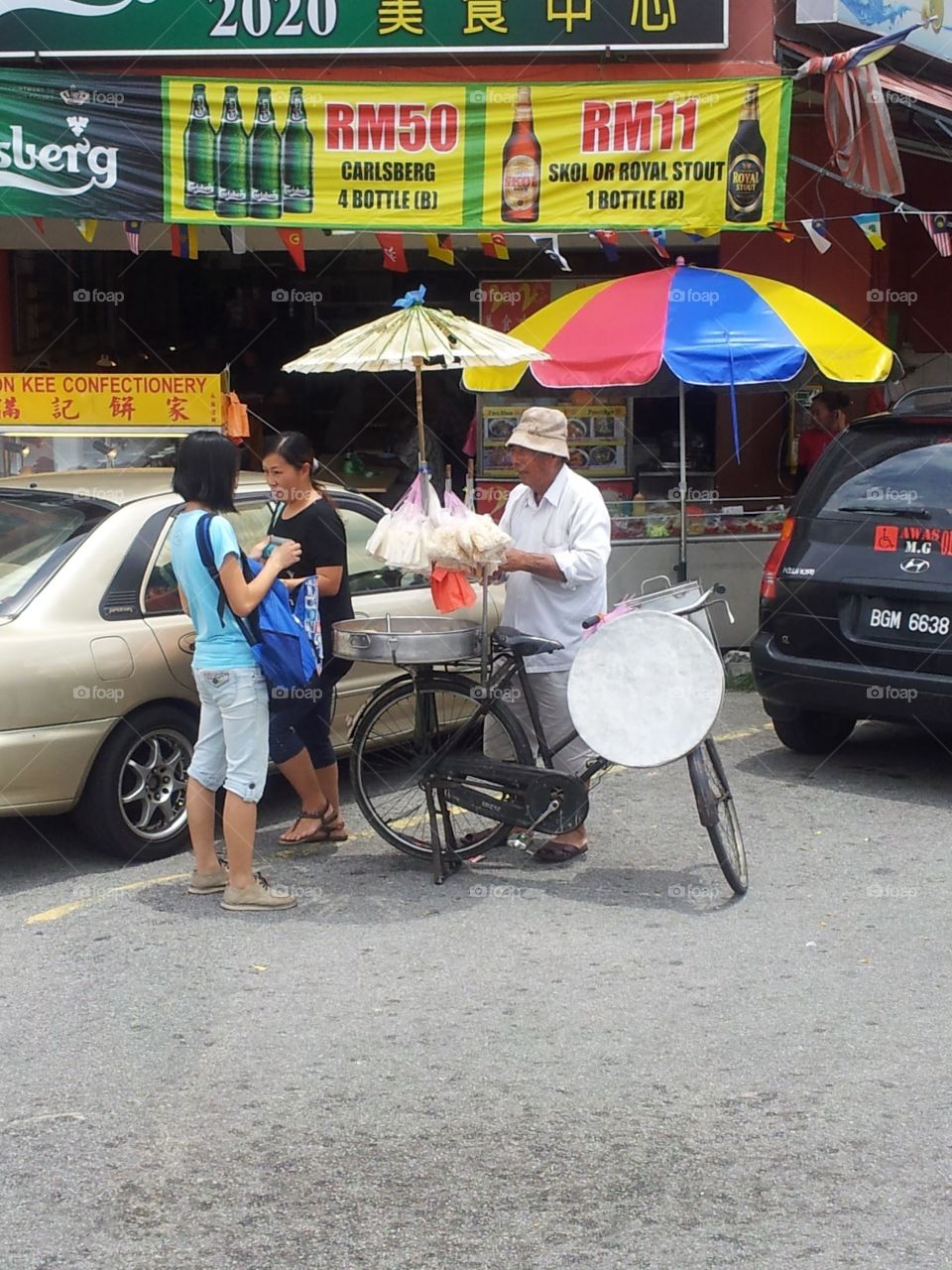 Chinese Candy seller. The last in the old tradition of Chinese candy sellers on bicycle