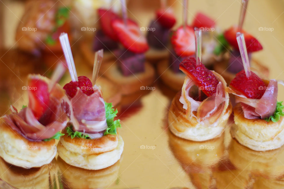 Canapés with meat and strawberry 