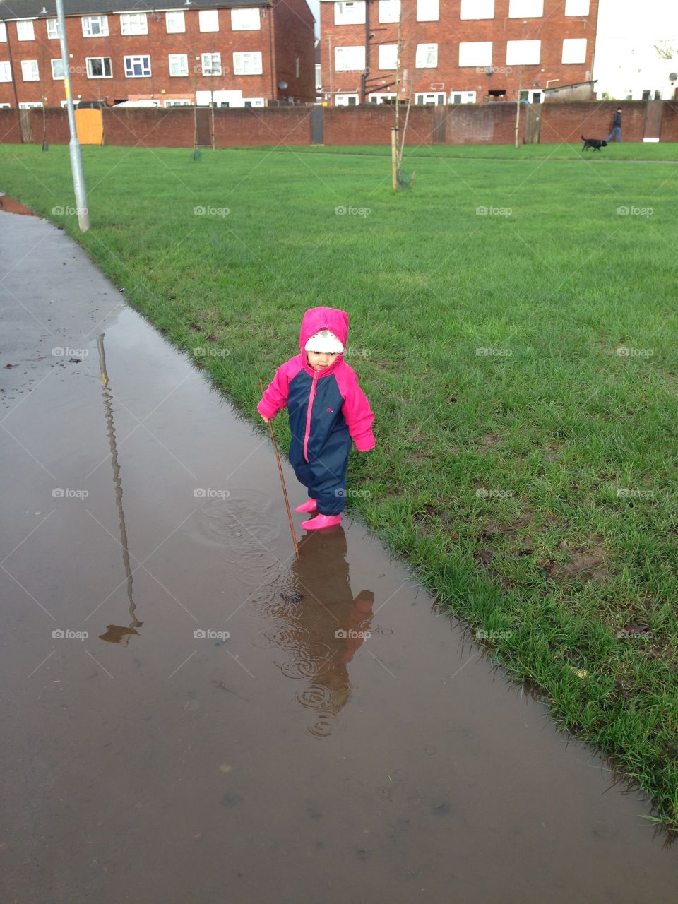 Baby playing in the puddle