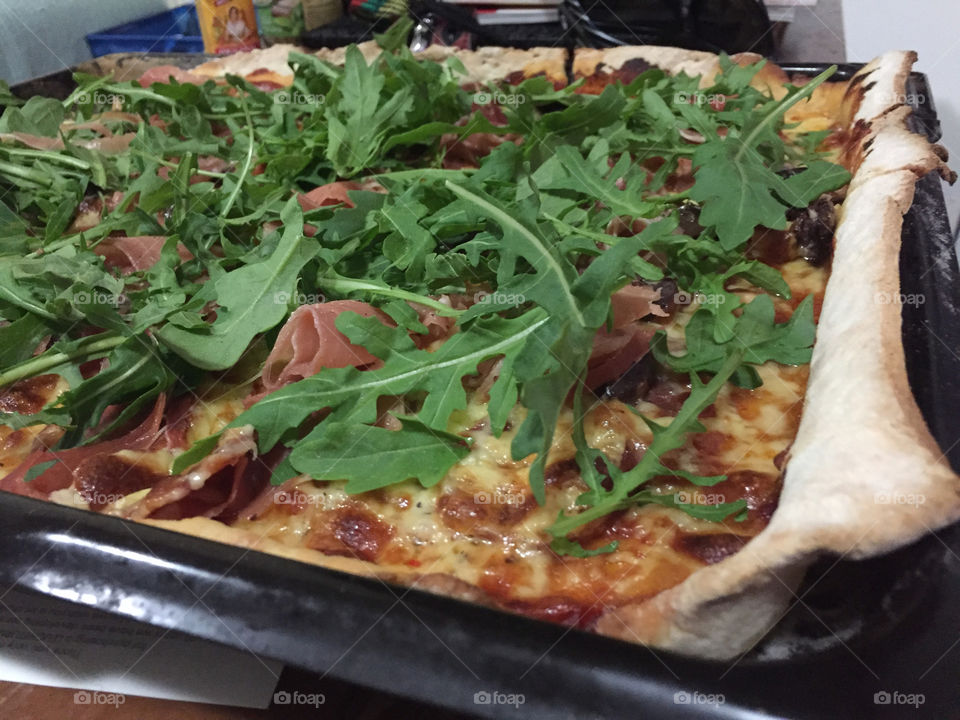 Pizza night at home. Homemade dough and lots of topping.