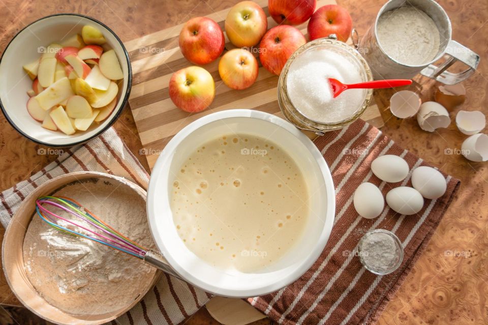Making homemade puffed apple pie with eggs, sugar and flour.